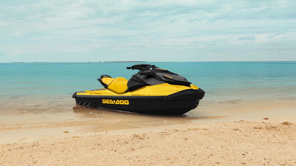 Yellow and black 2022 Sea-Doo GTR 230 on a beach