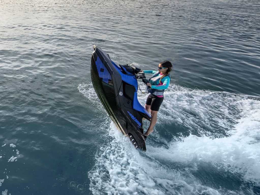 Blue and black 2022 Sea-Doo Spark Trixx performing a water stunt