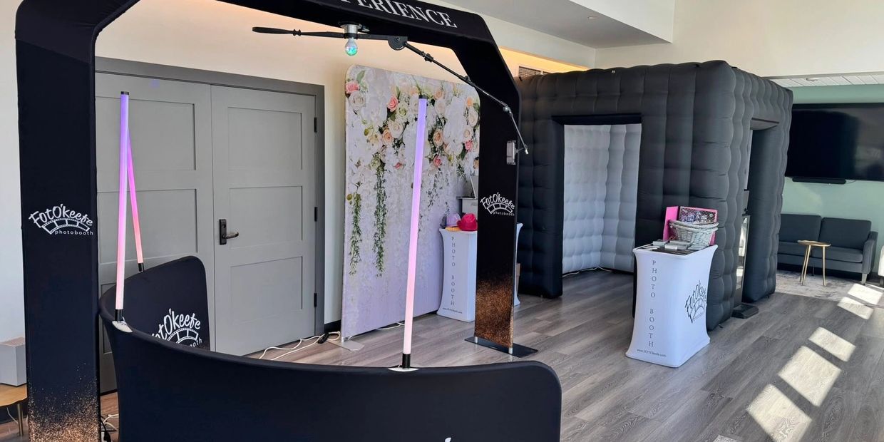 Modern FotoKeefe photobooth setup with 360 and inflatable booths indoors.