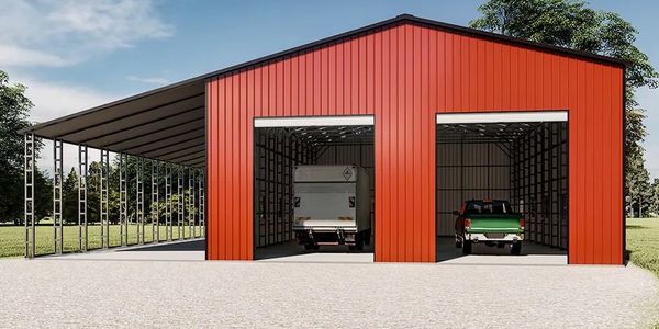 Red metal garage with two vehicles inside and an open side extension.