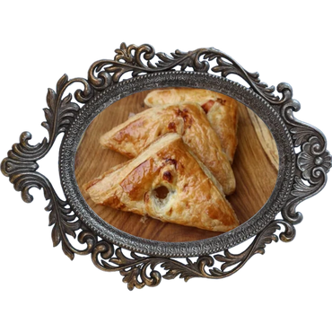 Tany's Turnovers (Empanadas).  Flaky Pastry folded and baked golden. Cinnamon, marionberry.