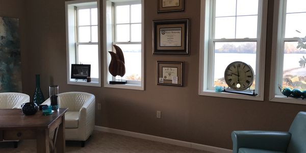 Inside office photo with four windows overlooking lake