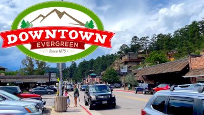 Downtown Evergreen street scene with cars and people.