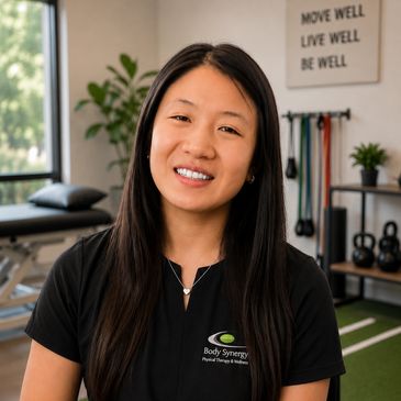 Smiling woman in a physical therapy clinic.