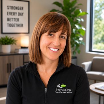 Smiling woman in a wellness center setting.