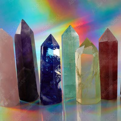 Collection of crystals illuminated by a prism, highlighting their unique shapes, colors and textures