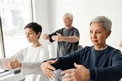 Tai Chi sequence being trained by mature adults