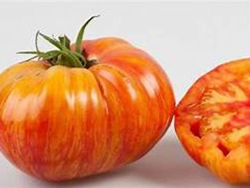 Two pound yellow fruit has red marbling through the flesh. The flavor is very sweet and fruity.