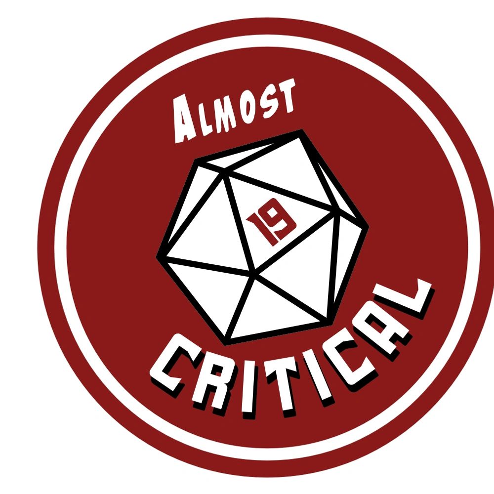 Dark red circle containing the words Almost Critical and a D 20 with the 19 face highlighted