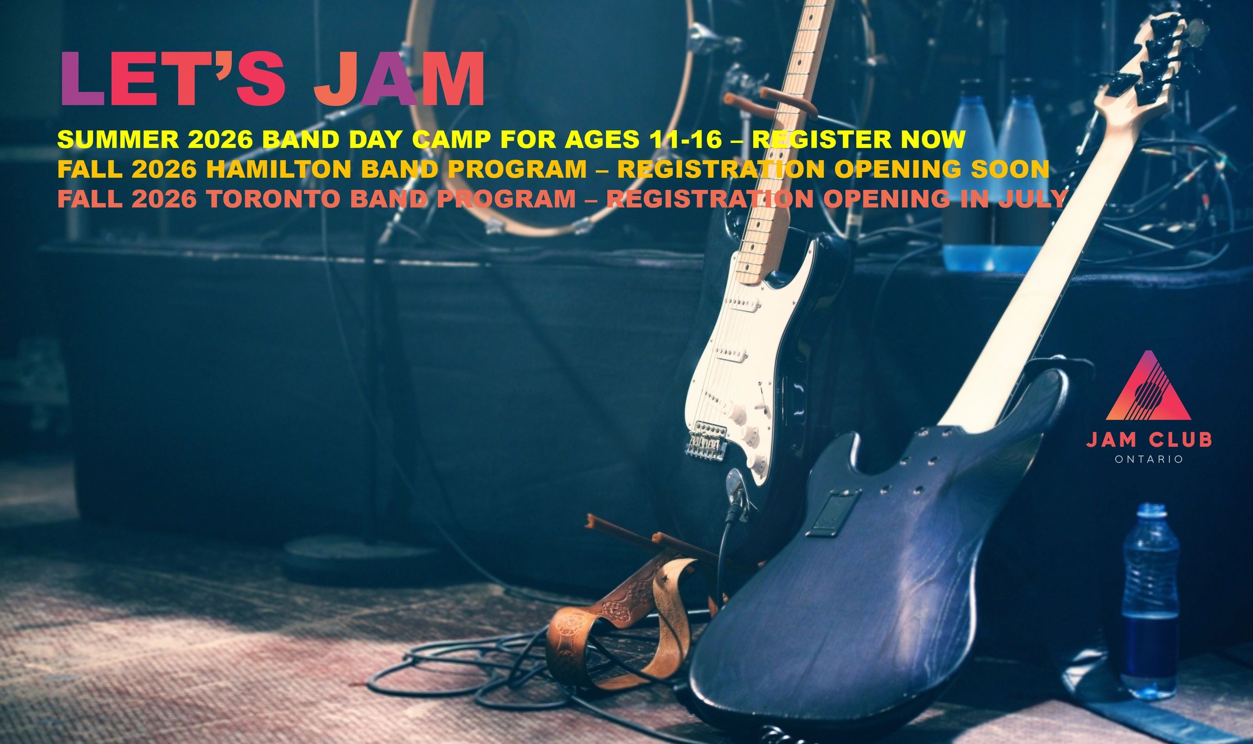Guitars resting on a stage, with open bottles of water. Looks like the band is on set break.