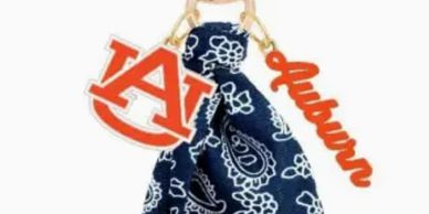 Auburn-themed keychain with bandana and logo charms.