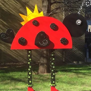 Colorful ladybug art sculpture outdoors.