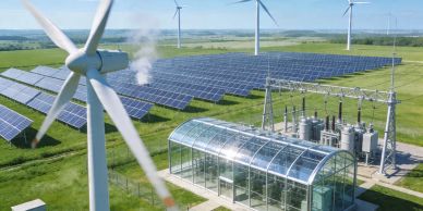 Wind turbines and solar panels generating renewable energy in a green field.