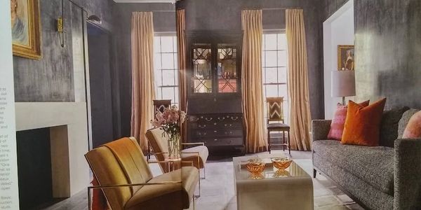 Cozy living room with warm lighting and elegant furniture.