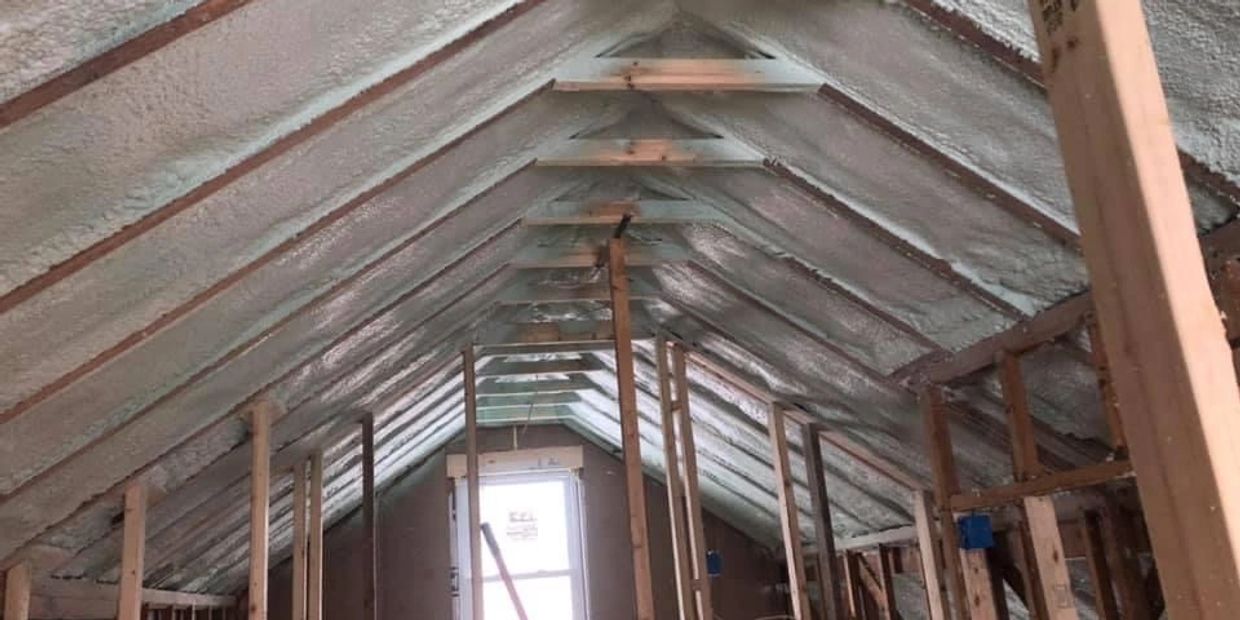 Roofline insulated with spray foam and ready for sheetrock.