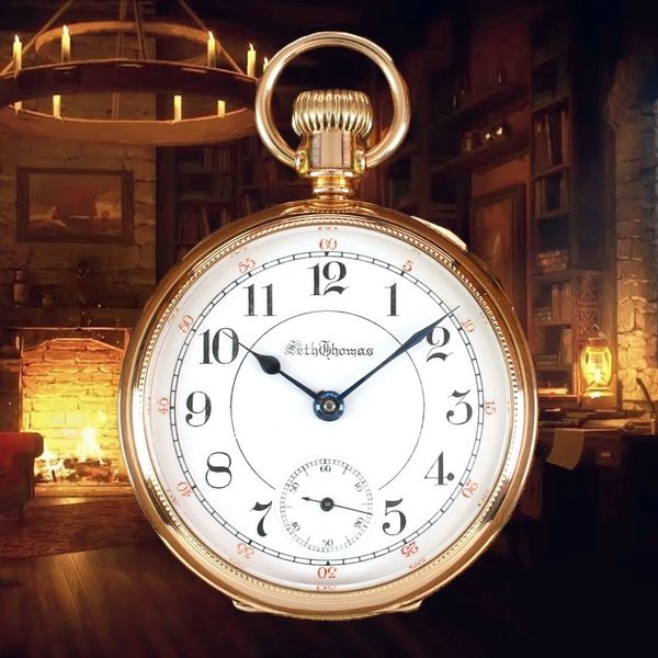 A vintage gold pocket watch with a white face in a cozy room with a fireplace.