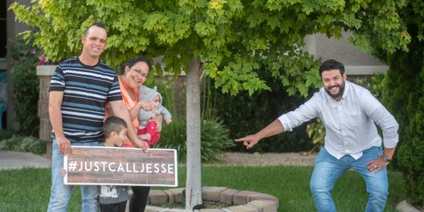 Real Estate Agent, Jesse Mendoza, poses with family on the day of their closing. 