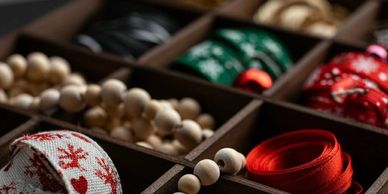 Christmas decorations organized in a wooden tray.