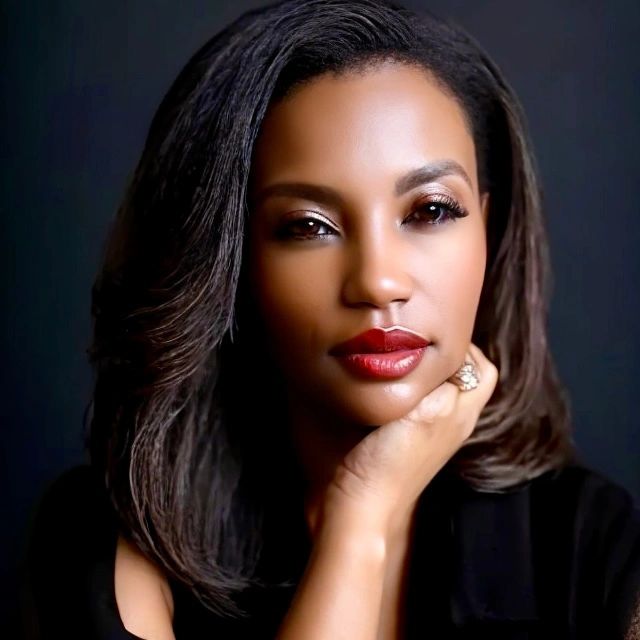 Close-up portrait of a woman with red lipstick and elegant makeup.