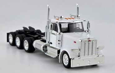 White semi-truck model with shiny chrome details on a plain background.