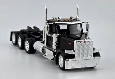 Black and chrome semi-truck model with detailed features on a plain background.