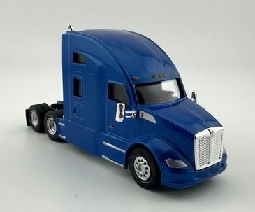 Blue semi truck model with chrome details on a white background.