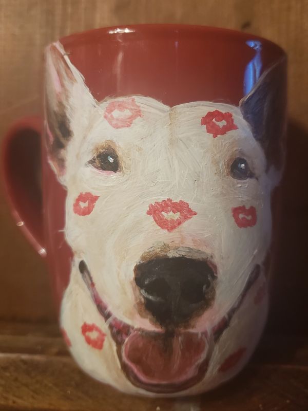 Red mug with a smiling bull terrier 