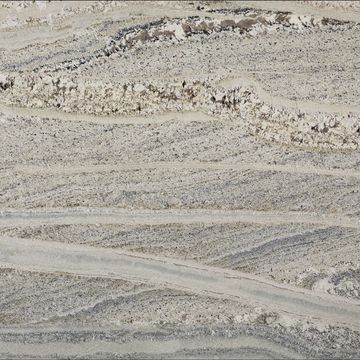 The veining and movement of this granite will change from block to block, as will the color tones. 