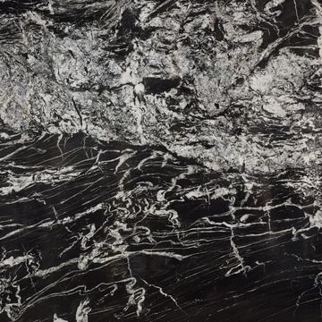 black background interspersed with ribbons of white, milky and clear quartz veins that permeate 