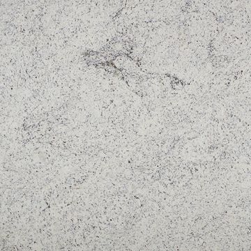 This white granite will have slight veining or consolidation of the dark crystals within these slabs