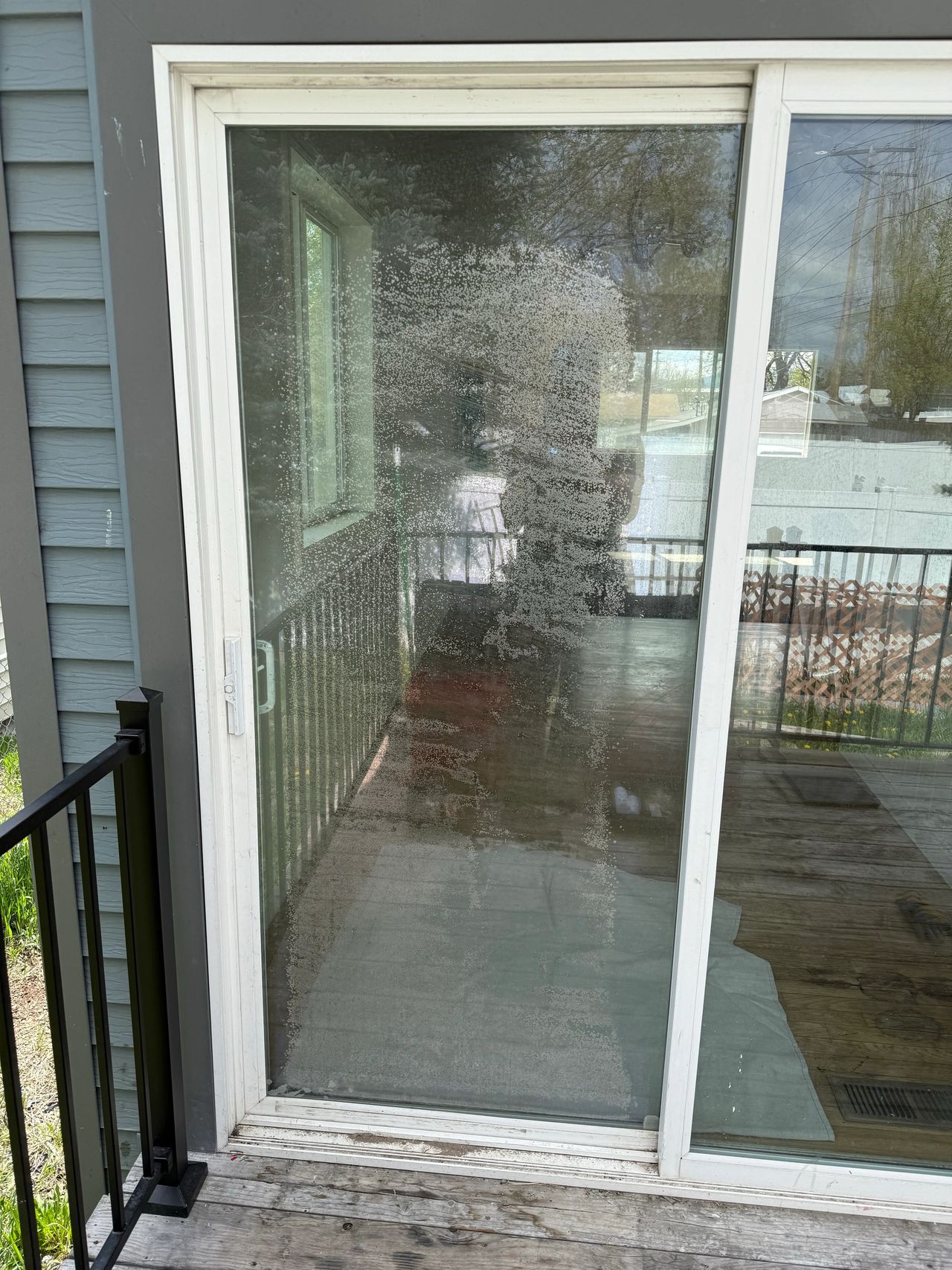 the before photo of a sliding door with a failed glass seal in Kalispell Montana 59901 that Precision Glass helped with!