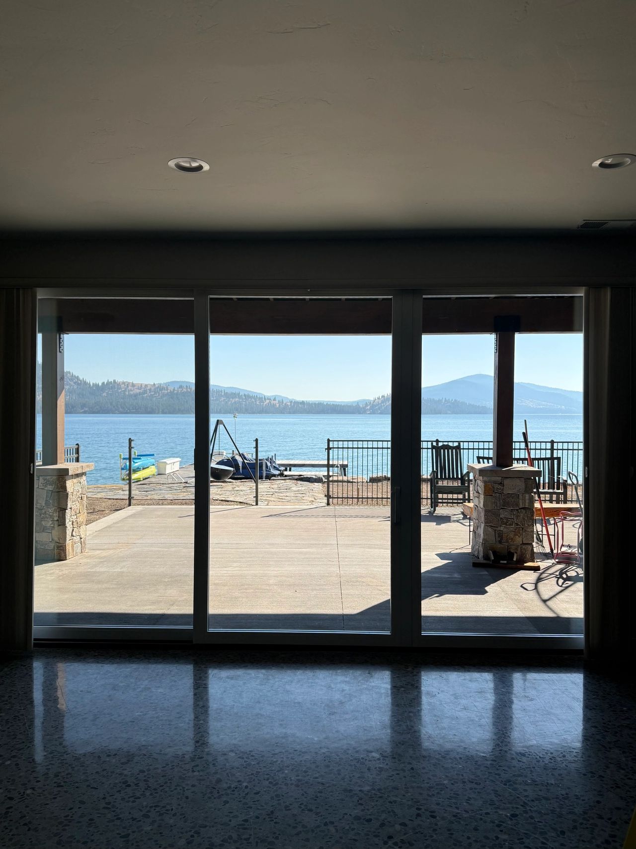 Interior view of the basement Pella Lifestyle triple sliding door Precision Glass installed in Lakeside Montana