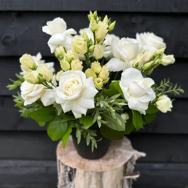White and cream flower vase arrangement  with roses and lisianthus, perfect for sympathy delivery.
