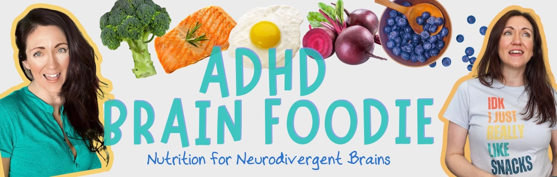 Stack of books next to pencils in a holder and a camera.