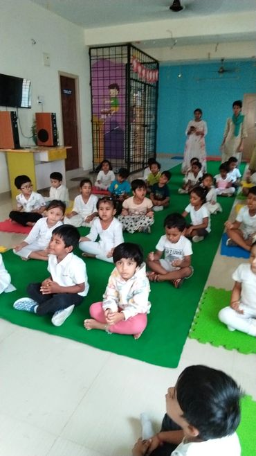 cute kids on occasion of yoga day. yoga day in a school, celebrating with sampoorna arogya