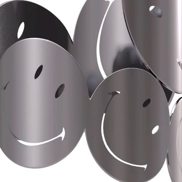 Metal bracelet with linked smiley face discs.