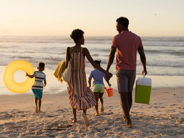 View of a family enjoying a tropical beach  - personalized travel planning by Travel Ali YYZ