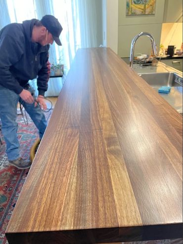 Finished 10 ft edge grain walnut bar. Constructed from customers tree slabs from tree in yard. 