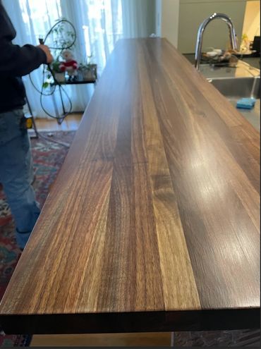 Finished 10 ft edge grain walnut bar. Constructed from customers tree slabs from tree in yard. 