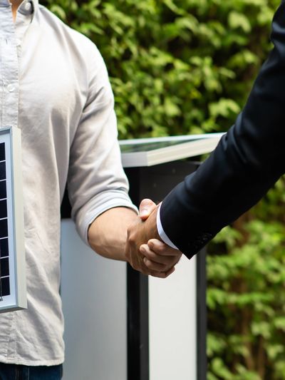 Two people shaking hands indicating a team effort in how we work at D-Tyl Electric