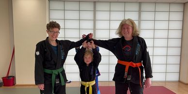 Parents smiling after a friendly martial arts match, demonstrating respect, sportsmanship and the va