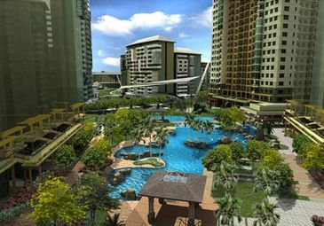 Modern resort pool area amidst tall buildings.
