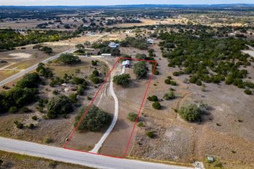 Aerial view of a rural property with red boundary lines.