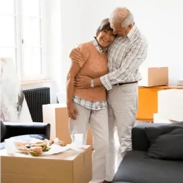 An older couple embracing after thir Senior Transition