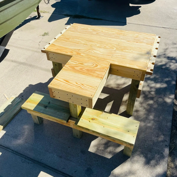 Treated shooting bench with barrel rests