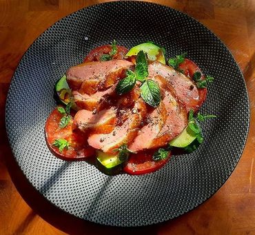 HOMESMOKED FREERANGE DUCKBREAST ON MARINATED COURGETTE AND TOMATOE WITH LEMONBALM