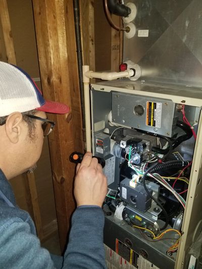 Eddie Rose Inspecting a furnace