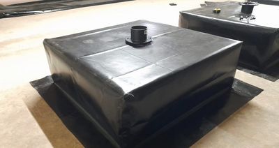 A box welded liner with bottom drain fitted