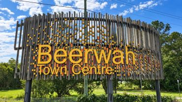 Sign for Beerwah Town Centre under a blue sky.