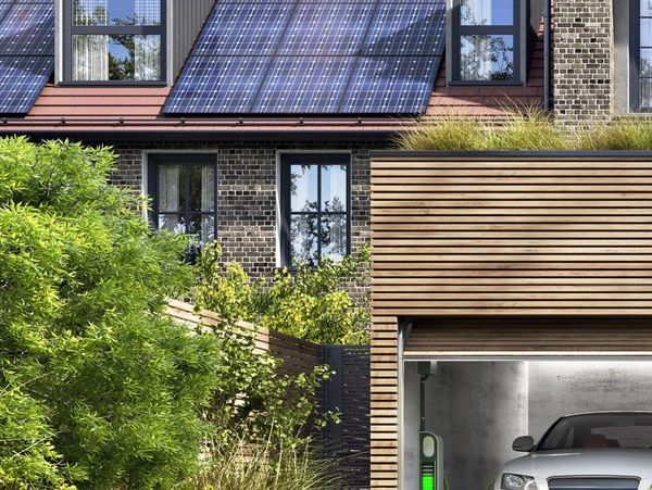 solar panels on a home with an EV car and charger